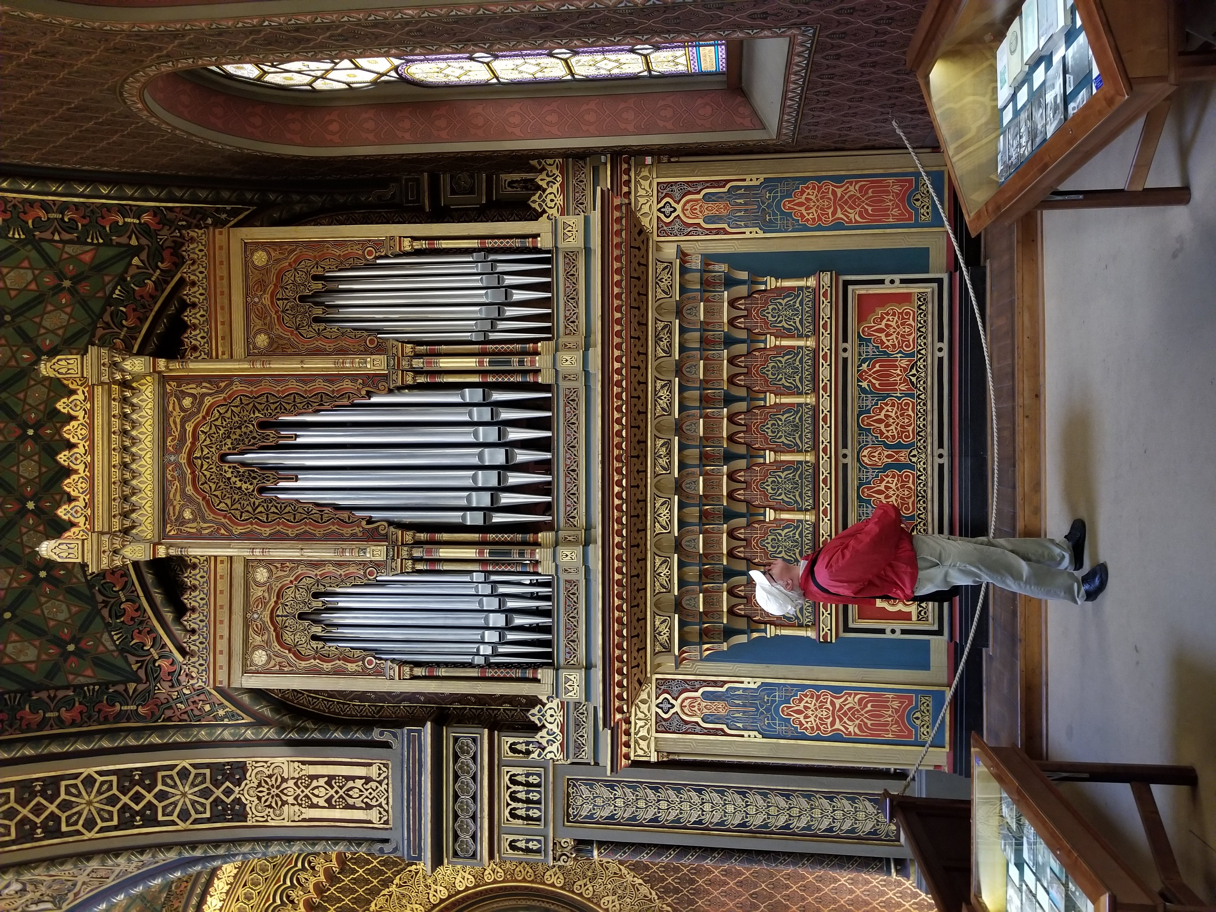 Arthur in a grand European hall, arms wide